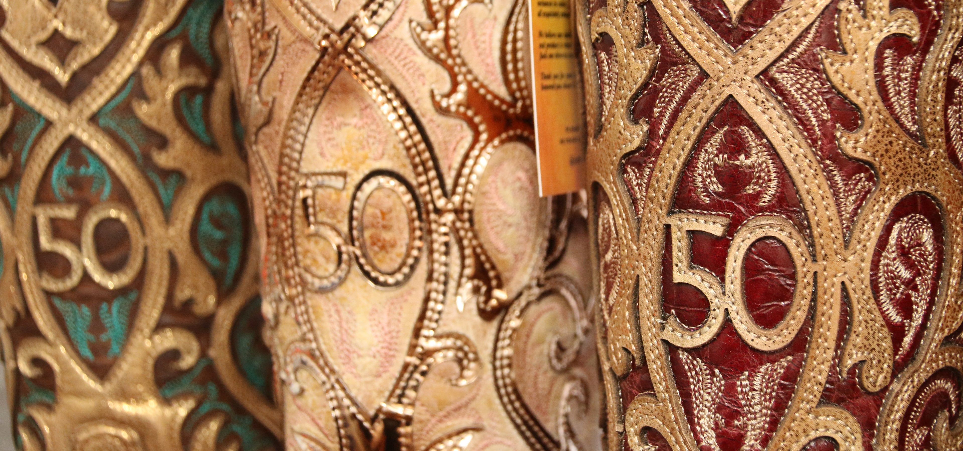 Close-up image of 3 pairs of custom-designed 50th anniversary French's boots designed by Corral Boots